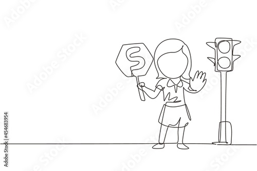 Continuous one line drawing little girl holding stop sign in arm standing near road, pedestrian rules for kids, traffic light in vector style. Child holding stop sign. Single line design illustration