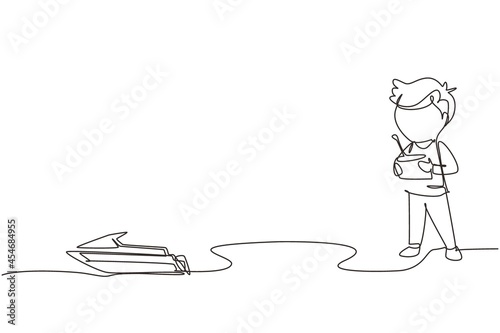 Continuous one line drawing boy playing with remote-controlled motor boat toy. Cute kids playing with electronic motor boat toy with remote control in hands. Single line draw design vector graphic