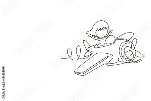 Single one line drawing little girl operating plane. Kids flying in airplane. Happy smiling kid flying plane like real pilot and dreaming of piloting profession. Continuous line draw design graphic