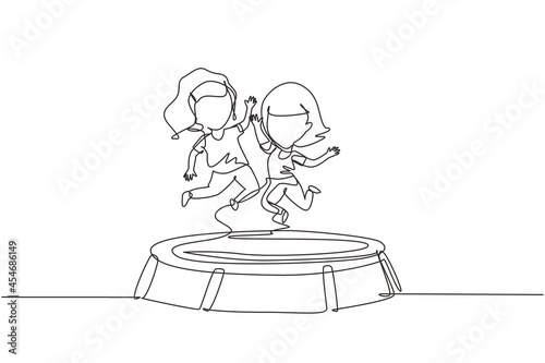 Single continuous line drawing two little girl jumping on trampoline together. Happy kids jumping on round trampoline. Active children's outdoors games. One line graphic design vector illustration
