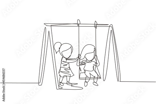 Single one line drawing cute little girl swinging on swing and her friend helped push from behind. Kids playing swing together in kindergarten playground. Continuous line draw design graphic vector