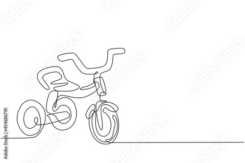 Single one line drawing kids tricycle. Children tricycle transportation. Tricycle, children bicycle. Sketch scratch board imitation. Modern continuous line draw design graphic vector illustration photo