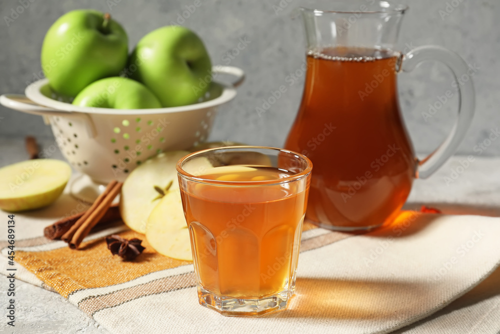 Glass of apple juice on table Glass of apple juice on table