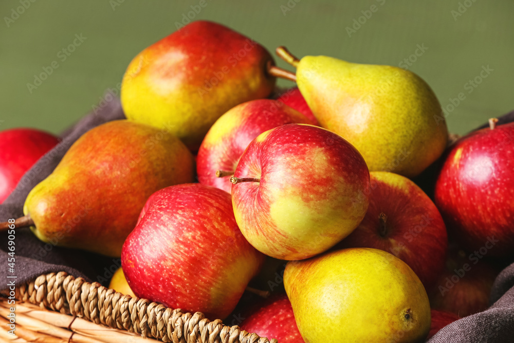 Box with ripe pears and apples on table, closeup Box with ripe pears and apples on table, closeup