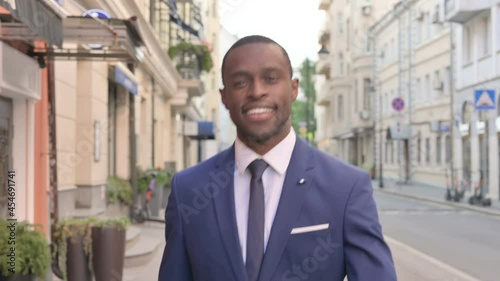 Wallpaper Mural Close up of Smiling African Businessman Walking on the Street Torontodigital.ca