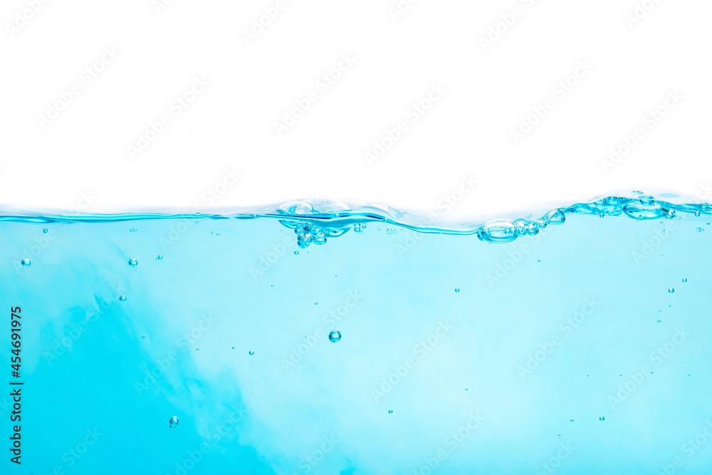 Blue water waves create bubbles and water splashes on the clear blue water surface. Blue water waves create bubbles and water splashes on the clear blue water surface.