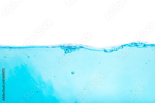 Blue water waves create bubbles and water splashes on the clear blue water surface.