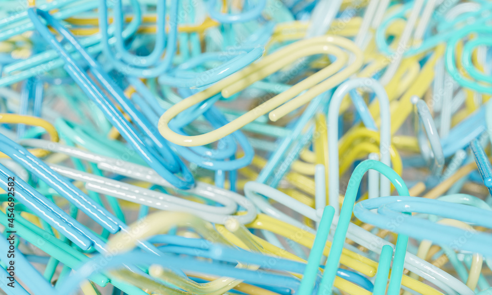 defocused background of paper clips in close up defocused background of paper clips in close up
