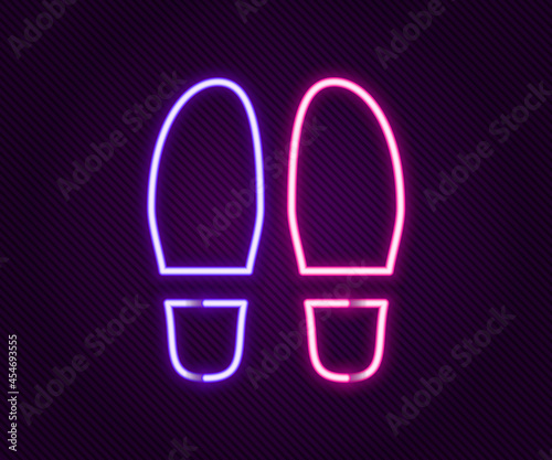 Glowing neon line Footsteps icon isolated on black background. Detective is investigating. To follow in the footsteps. Colorful outline concept. Vector