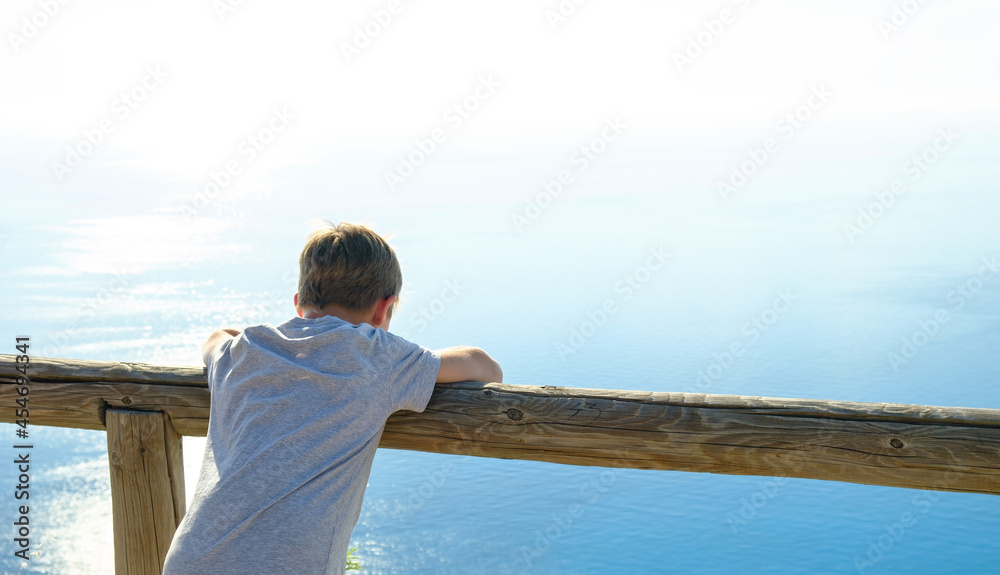 10 year's boy enjoying the view of the beautiful sea. 