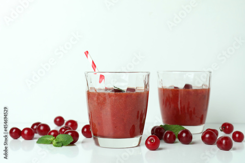 Wallpaper Mural Glasses of cherry smoothie and ingredients on white table Torontodigital.ca