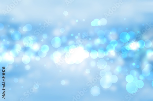 Abstract blurred fresh vivid spring summer light delicate pastel blue turquoise bokeh background texture with bright circular soft color lights. Card concept. Beautiful backdrop illustration. © Olga