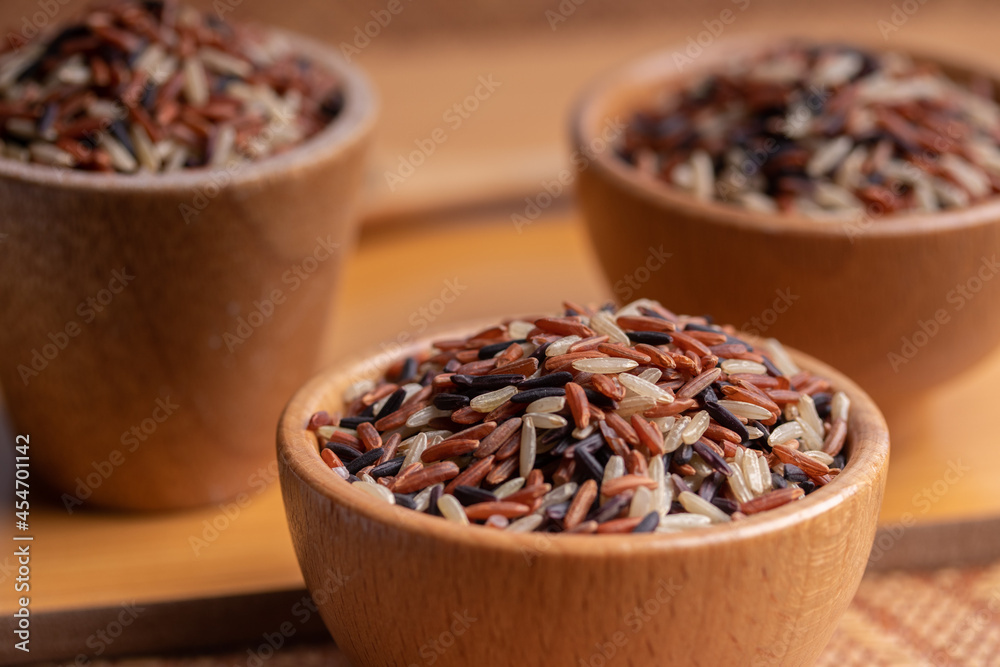 Jasmine Brown Rice in wooden bowl with copy space, Thai rice varieties Top view
