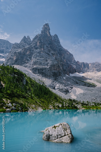 Morning with clear sky on Lago di Sorapis in the Italian Dolomites, milky blue lake Lago di Sorapis, Lake Sorapis, Dolomites, Italy.  photo