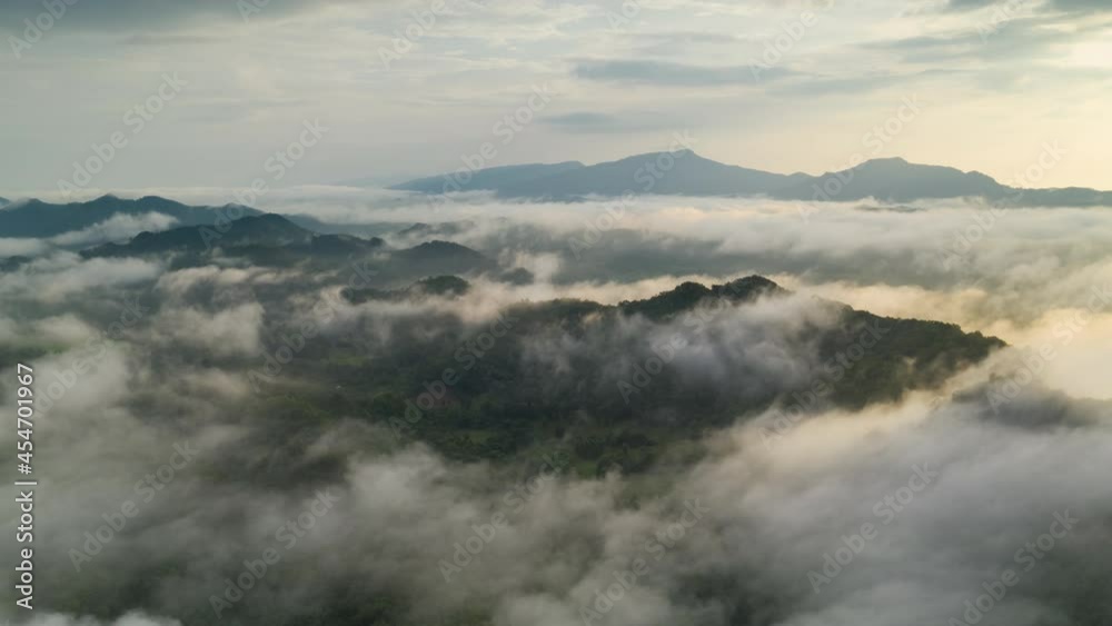 Aerial view Hyper lapse by Drone, Beautiful Landscape in the morning time during sunrise with fog above the mountain, White fluffy clouds moving softly on cloudy, Pang puai Mae moh Lampang, Thailand. Aerial view Hyper lapse by Drone, Beautiful Landscape in the morning time during sunrise with fog above the mountain, White fluffy clouds moving softly on cloudy, Pang puai Mae moh Lampang, Thailand.
