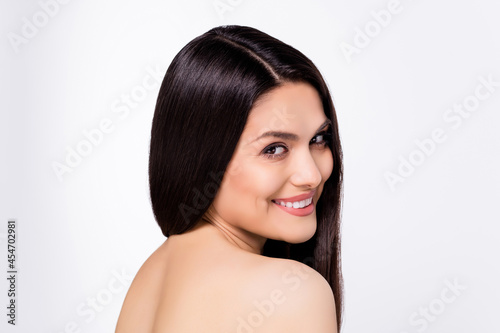 Back view photo portrait beautiful woman with silky straight hair smiling after bath isolated on white color background