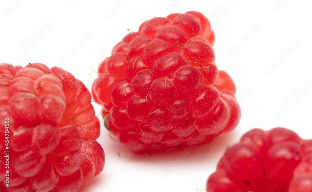 Red raspberries on a white background. Red raspberries on a white background.