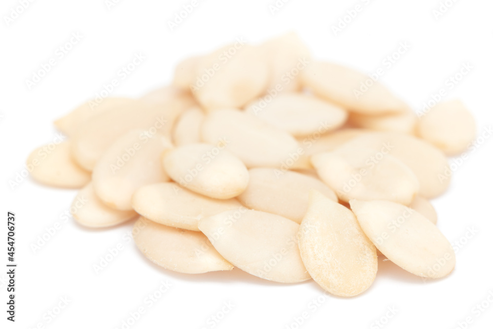 Micro close-up and details of Organic Indian watermelon seed (Citrullus lanatus) isolated over white background. Micro close-up and details of Organic Indian watermelon seed (Citrullus lanatus) isolated over white background.