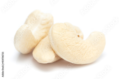 Micro close-up and details of Organic Indian dry fruit cashew nut (Anacardium occidentale) isolated over white background.