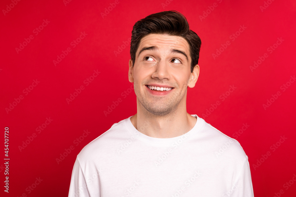 Photo portrait brunet wearing casual t-shirt happy looking copyspace isolated bright red color background