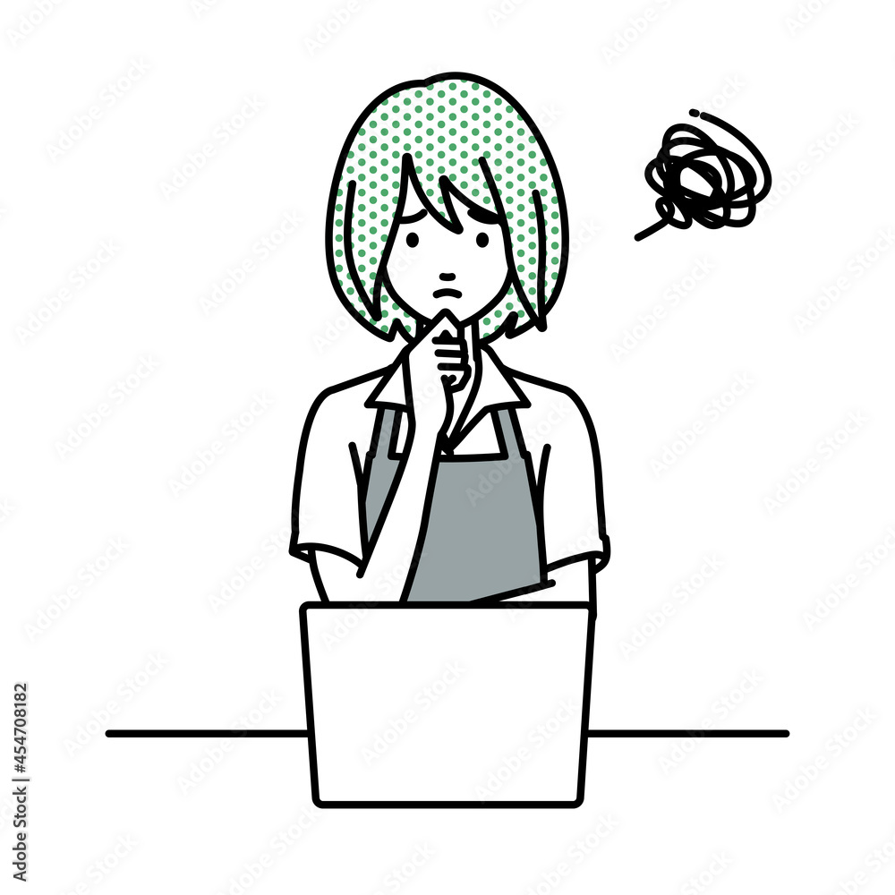 デスクで座ってPCを開いて困っているカフェ店員の女性