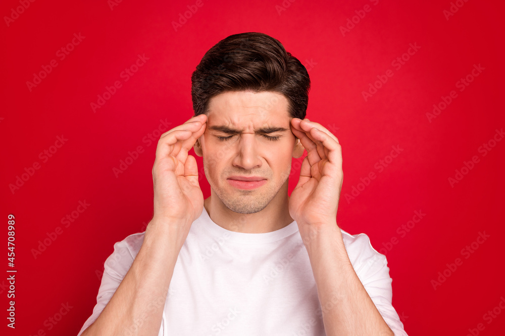 Photo portrait brunet in white shirt got headache need pills isolated vivid red color background Photo portrait brunet in white shirt got headache need pills isolated vivid red color background