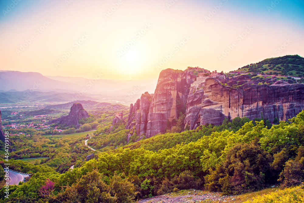 magnificent magical landscape in the famous valley of the Meteora rocks in Greece at sunset. Great amazing world. Attractions.