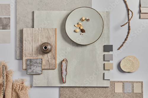 Flat lay of creative architect moodboard composition with samples of building, textile and natural materials and personal accessories. Top view,  white background, template. photo