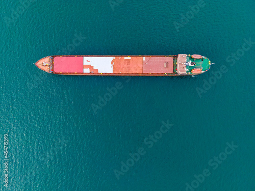 Top down aerial view of dry bulk carriers cargo ship in the sea