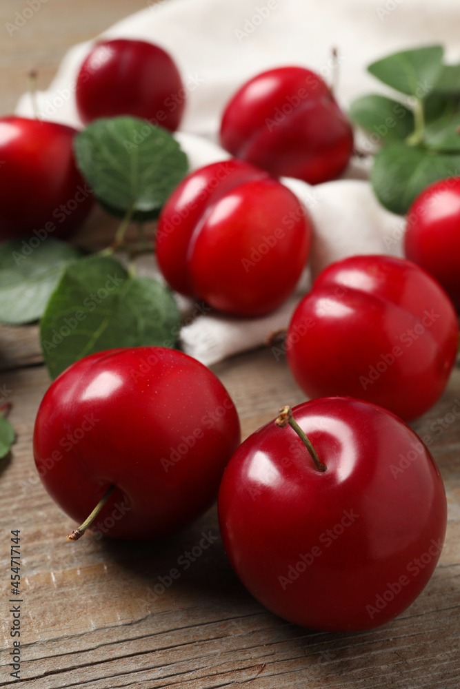 Fresh ripe cherry plums on wooden table, closeup Fresh ripe cherry plums on wooden table, closeup