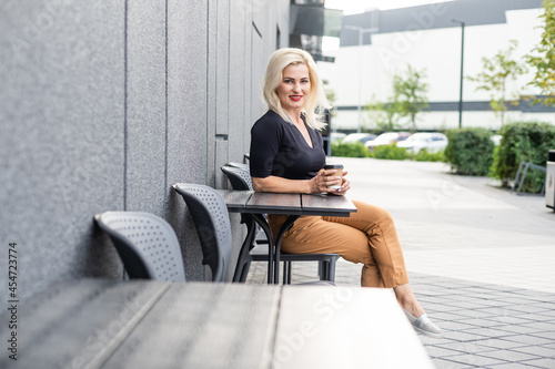 woman in a cafe drinking coffee