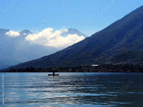 Man paddling in a boat on Lake Atitlan, Guatemala