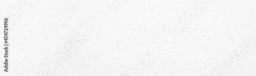 White rough textured surface. Whitewashed wall. Light wide large texture. Abstract panoramic background