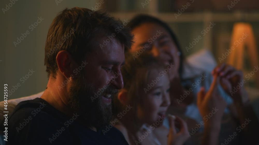 Man watching film with family Man watching film with family