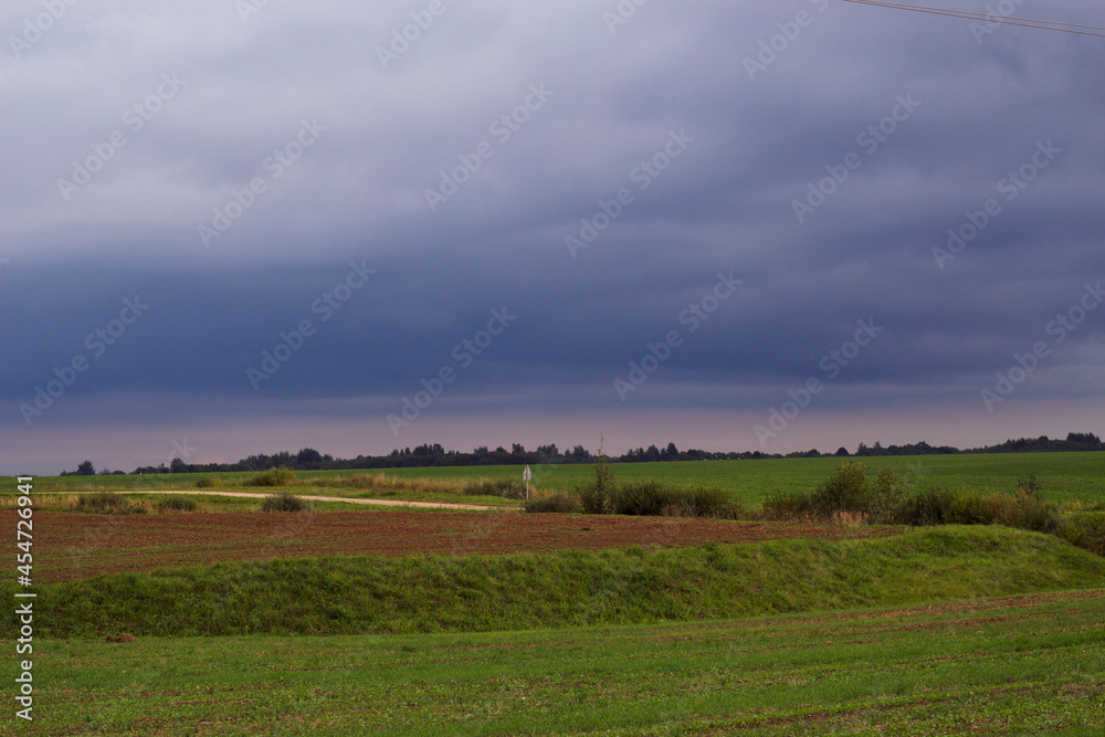 Dark clouds over the fields. Countryside landscape. Dark clouds over the fields. Countryside landscape.