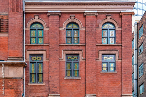 Colonial windows pattern in the exterior wall of the Massey Hall, Toronto, Canada photo