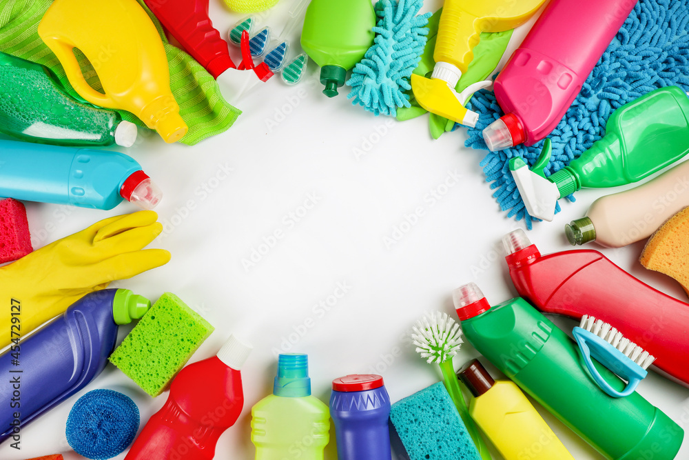Cleaning products on white background. Home cleaning concept. Top view Cleaning products on white background. Home cleaning concept. Top view