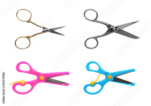 Set with different scissors on white background