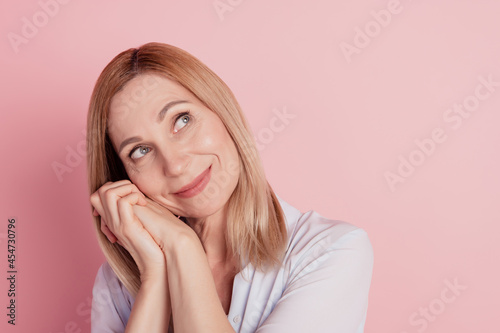Closeup photo of young woman hands touch cheek dream look empty space isolated pastel color background