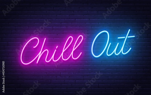 Chill Out neon lettering on brick wall background. photo