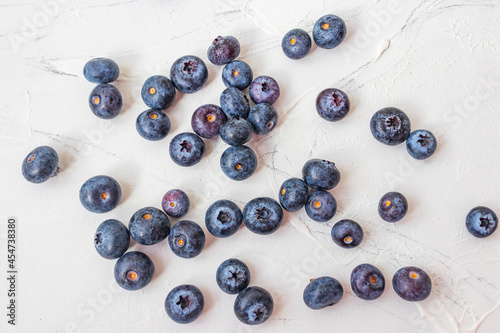 Lots of wet blueberry on white background.