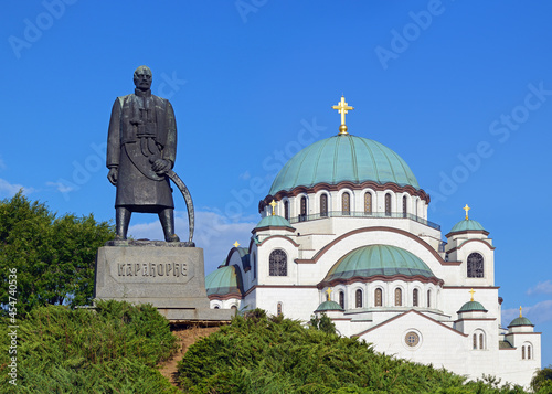 Karadjordje Monument with the Church of Saint Sava in the background, Karadjordjev Park, Belgrade, Serbia photo