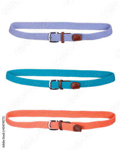 A collage of colored leather belts on white background. Children's belt on a white background.