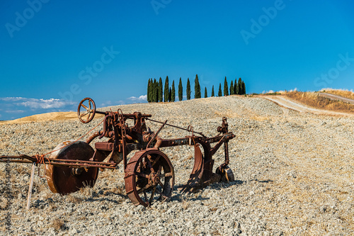 Typically Tuscany Landscape with acres and hayballs in summertime, Val d'Orcia, Siena Region, rolling landscape photo