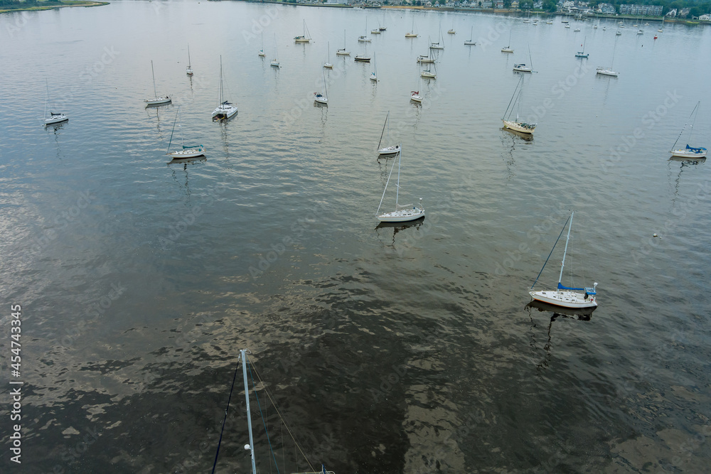 Aerial view of many yachts ocean boats with masts parking and floating