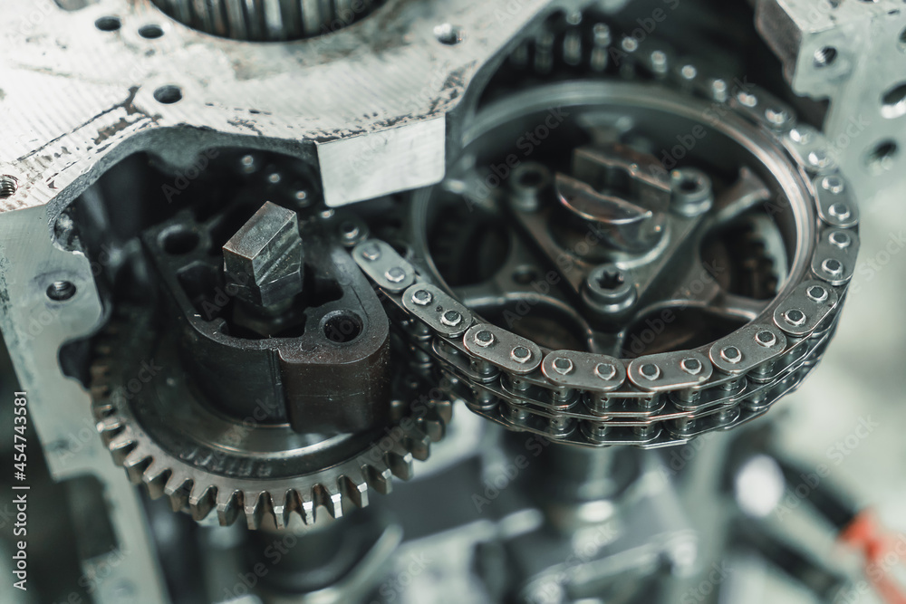 Close-up of the chain and gears of a car engine. Car engine repair Close-up of the chain and gears of a car engine. Car engine repair