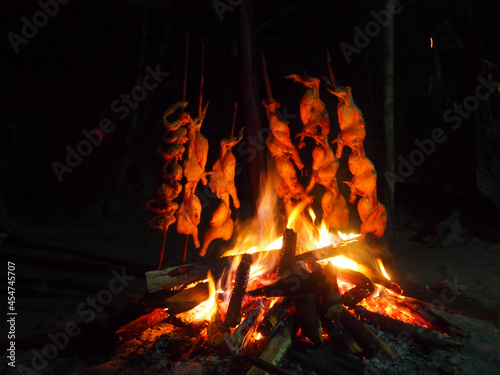 Chickens being roasted over a fire in Venezuela