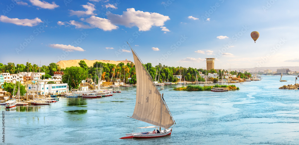 Nile river, a sailboat and a balloon, Aswan, Egypt