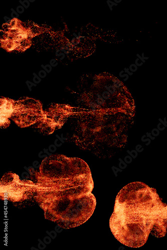 3d render of exploding with particles and depth of field. Warm bright flame. Detailed simulation.