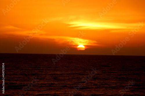Sunset view at beach with reflection on water © ARPIT